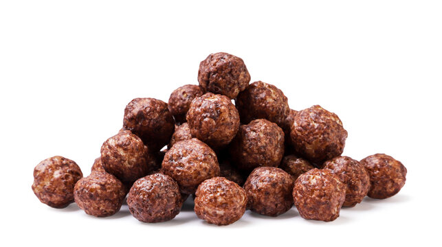 Pile of chocolate corn balls close-up on a white background. Isolated