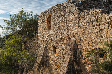 Fototapeta premium Fragment of the facade of a medieval building - expensive maintenance of an ancient stone house