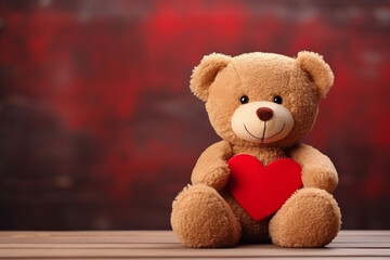 Cute teddy bear with red heart on old wood, copy space, red background. Valentine Concept