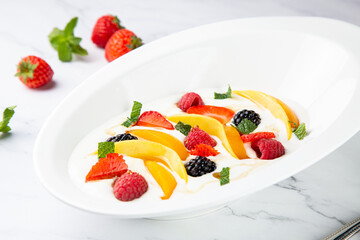 fruit salad with wild berries and strawberries side view