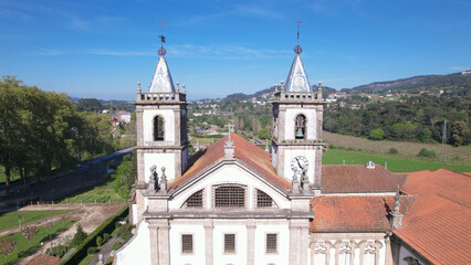 Fototapeta na wymiar Aerial view of the Monastery of St. Benedict (Sao Bento) in the city of Santo Tirso, Portugal, with the Ave River in the background. Benedictine order.