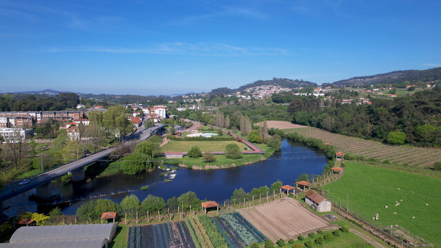 Aerial view of small waterfall on the Ave River in Santo Tirso, Portugal.