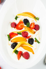 fruit salad with wild berries and strawberries top view