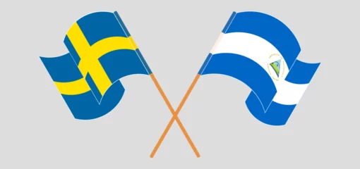 Foto op Aluminium Crossed and waving flags of Sweden and Nicaragua © valyalkin