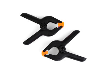 Plastic clamps for woodworking on white background.