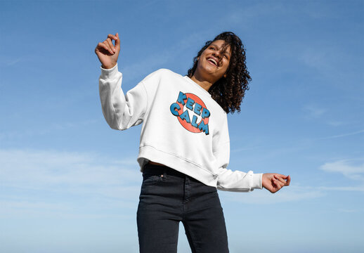 Mockup of carefree woman wearing customizable t-shirt, dancing