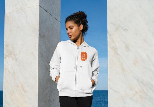 Mockup of woman wearing customizable zipper hoodie with hands in pockets