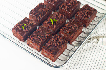 Delicious chocolate brownies with mint on white background. Sweet cake concept. 