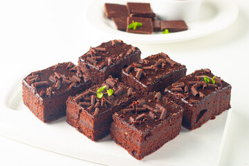 Delicious chocolate brownies with mint on white background. Sweet cake concept. 