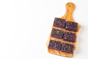 Delicious chocolate brownies with mint on white background. Sweet cake concept. 