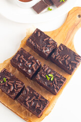 Delicious chocolate brownies with mint on white background. Sweet cake concept. 