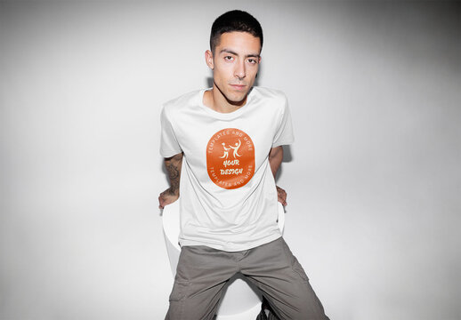 Mockup of man wearing customizable t-shirt in studio, camera flash