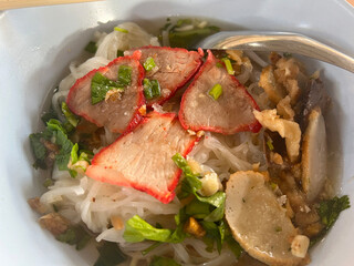 close up view of delicious asian cuisine, red pork noodle