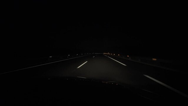 view from inside the car on the night road in the headlights