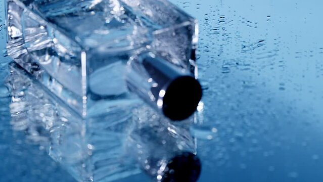 wet perfume on blue rotating  camera