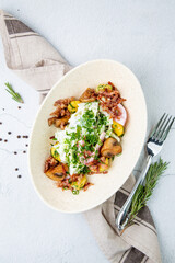 salad with potatoes, rice, meat and green onions top view