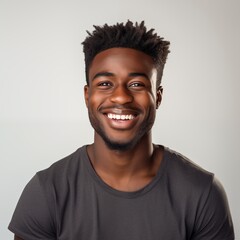Obraz premium Smiling cheerful young adult african american ethnicity man looking portrait on white background