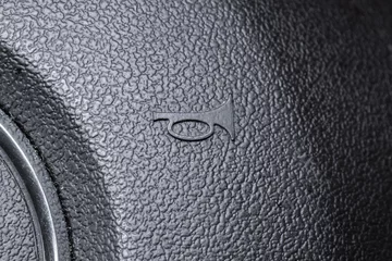 Foto op Plexiglas Modern car air horn icon or symbol on a steering wheel. Close up macro shot, no people © Octavian