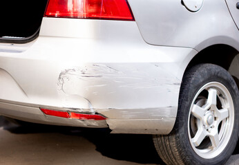 Broken and chipped car rear bumper - obrazy, fototapety, plakaty