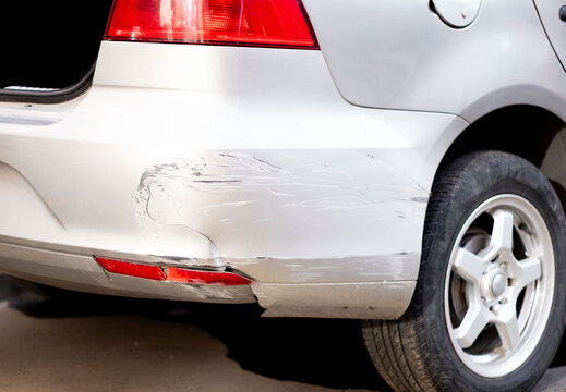 Broken and chipped car rear bumper