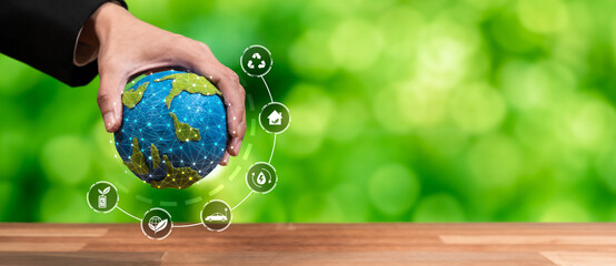 Businessman holding Earth with eco friendly icon design symbolize business company commitment to...