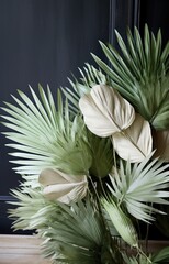 palm leaves in shades of green with white stems