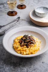 Pumpkin risotto  with mushrooms, Parmesan cheese and herbs