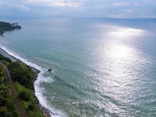Aerial panoramic view scenic Black Sea coast flora with calm seashore on sunset in summer. storm. Tsikhisdziri and Kobeleti wild hidden beach in Georgia. the railway