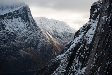 Aerial of beautiful Norwegian fjords with snowcapped mountains.  Located in the far northern...