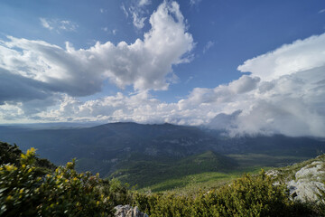 Clouds casting shadows over Herault's peaks.