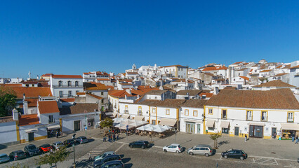 View over clay bricks roof tops the with clear blue sky on a sunny day of old town of Evora, Alentejo, Portugal