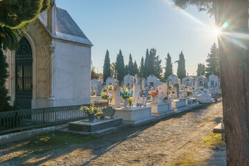 Beautiful traditional portuguese graveyard Cemiterio de Evora with graves and tombstones made out...