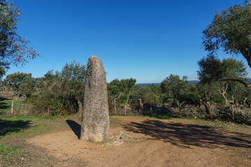 Menhir dos Almendres with a blue sky near portuguese town Evora, Alentejo, Portugal