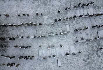 Aerial drone view of the wall and graves of an old abandoned cemetery. inventory of graves and...