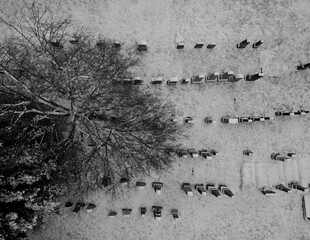Aerial drone view of the wall and graves of an old abandoned cemetery. inventory of graves and outlines of lost and overgrown positions. archaeological research in practice. meadow with tombstones - obrazy, fototapety, plakaty