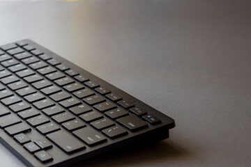Mobile wireless keyboard on desktop. Banner for a review or article about keyboards with copy space.
