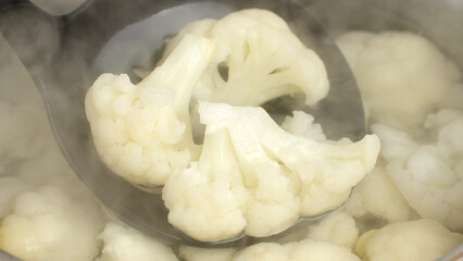 Fresh cauliflower boiling in water