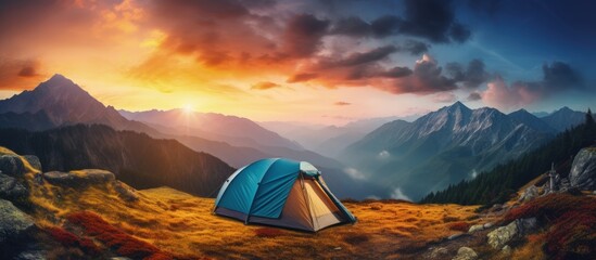 Colorful evening sky seen from a mountain campsite where travelers enjoy an adventurous vacation copy space image