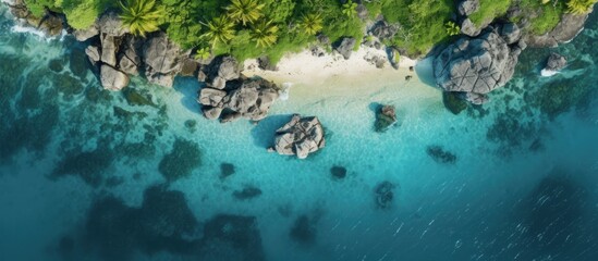 Fototapeta na wymiar Aerial drone photo of small island with limestone and emerald sea copy space image