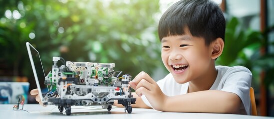 Asian children happily engage in self paced online lessons excitedly creating AI circuit toys 