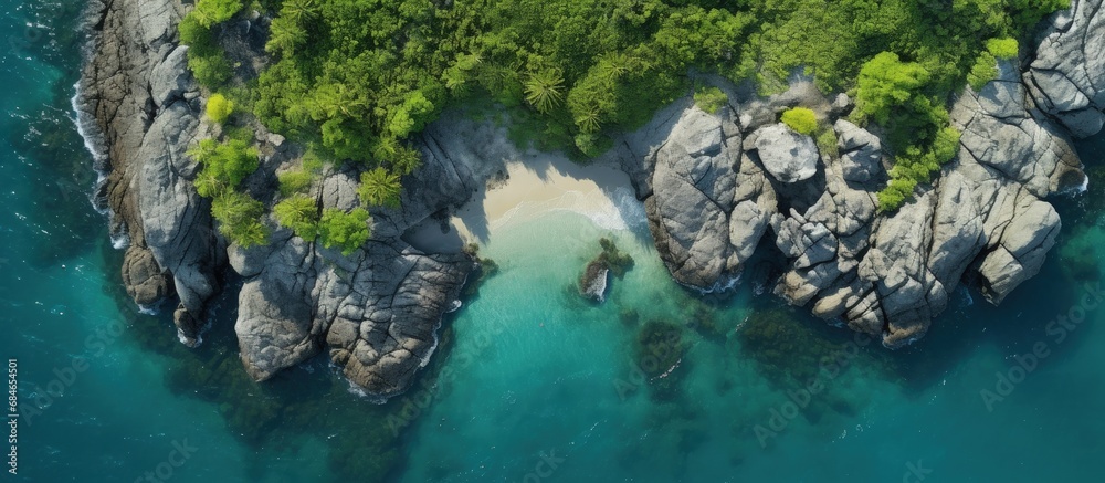 Poster aerial drone photo of small island with limestone and emerald sea copy space image