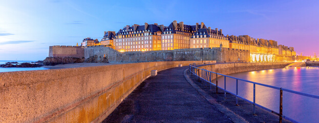 Panoramic view of Medieval walled city and fortress Saint-Malo at sunset, Brittany, France