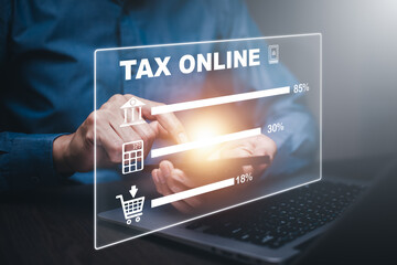 Business people work on laptops to pay taxes online or refund tax of duty taxation business graphs and charts demonstrated on the screen media.