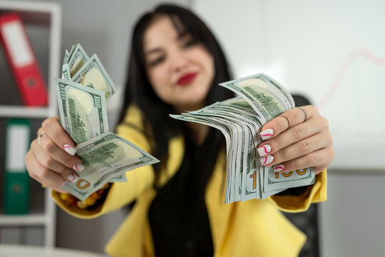 Business woman counting dollar banknotes for payment salary or tax, use laptop  finance documents