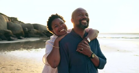 Happy couple, embrace or hug with smile on beach vacation, trip or travel to coast. Mature, black man and woman with excited emoji on face with holiday for relaxing, calm and peace in bond together - Powered by Adobe