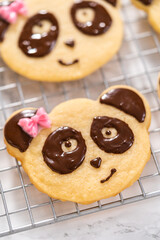 Panda shaped shortbread cookies with chocolate icing