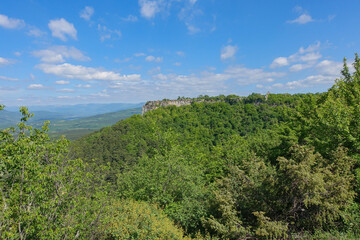 Obraz premium Mangup-Kale cave city, sunny day. Mountain view from the ancient cave town of Mangup-Kale in the Republic of Crimea, Russia. Bakhchisarai.