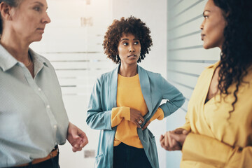 Group of diverse businesswomen talking together in an office