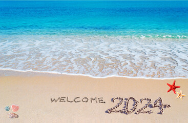 Welcome 2024 written on the sand