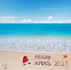 Fototapeta na wymiar Merry Xmas 2023 at the beach